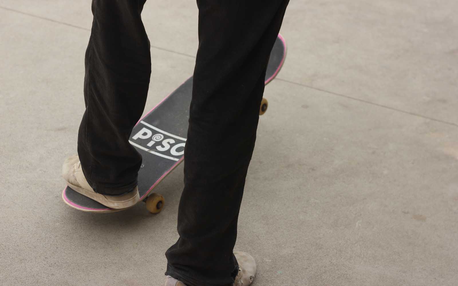 A skater standing on a Piso Skateboard